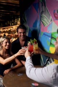 Friends doing cheers at a birthday party